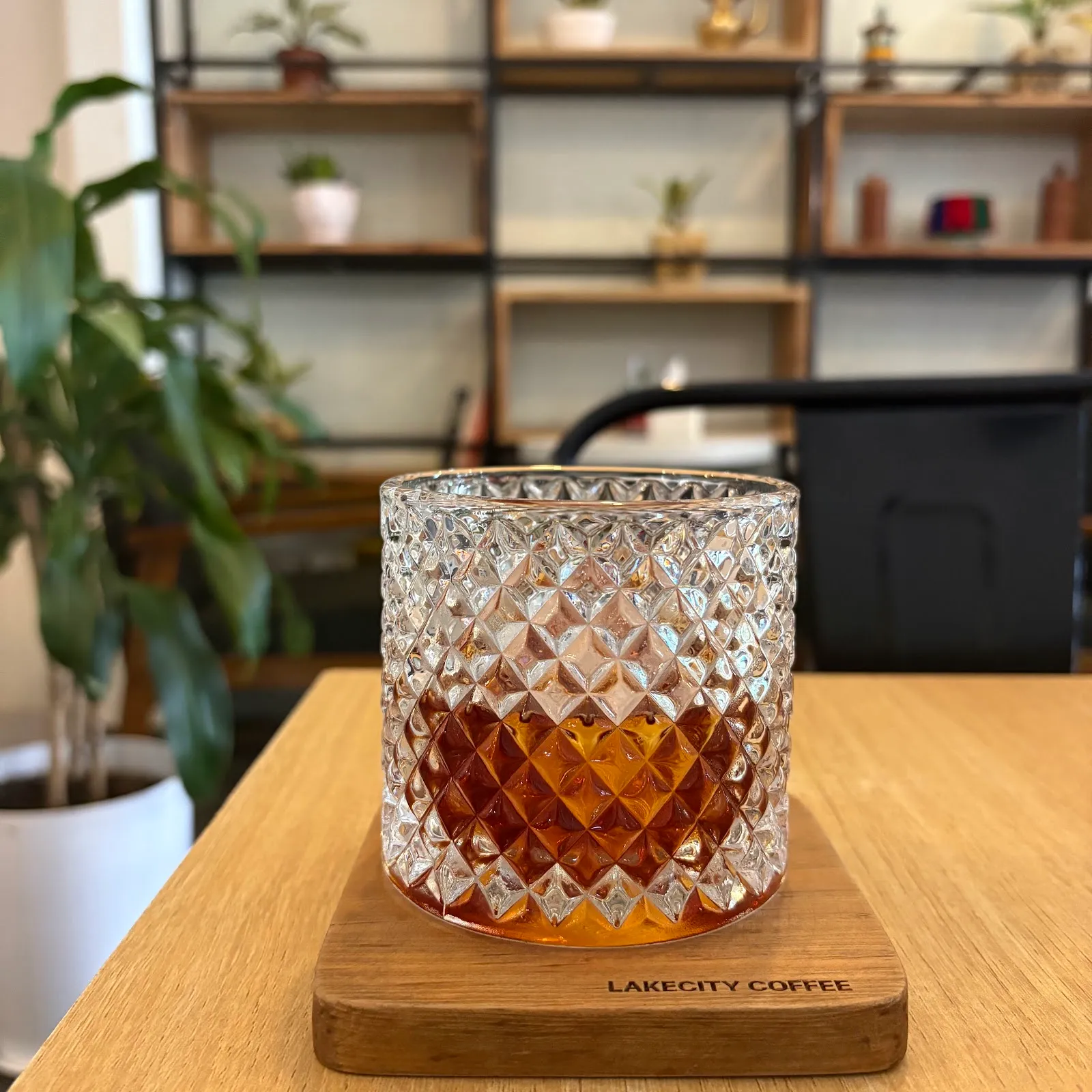 Espresso on the rock served on a Lake City Coffee branded wooden coaster